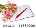 notebook with a pen and flowers 11339200