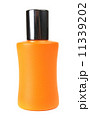 orange small bottle with a perfume liquid 11339202
