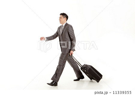 Businessman walking with Trolleybag Businessman walking with Trolleybag 11339355