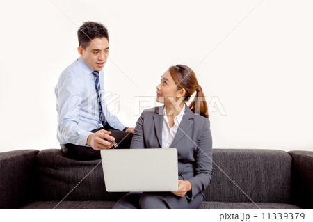 Businessman and Businesswoman Discussion with Laptop Businessman and Businesswoman Discussion with Laptop 11339379