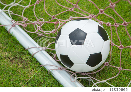 Soccer ball in the goal after shooted 11339666