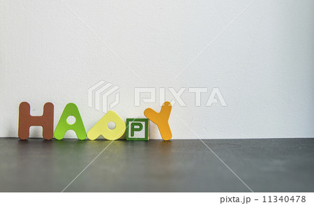 Colorful wooden word Happy with white background Colorful wooden word Happy with white background 11340478