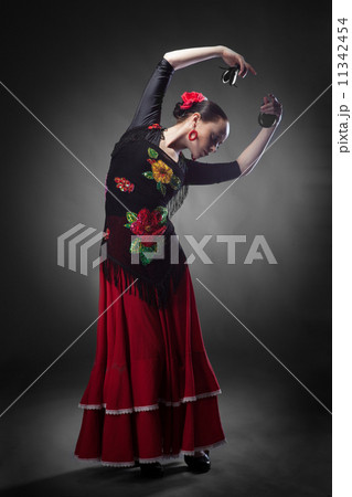 woman dancing flamenco with castanets 11342454