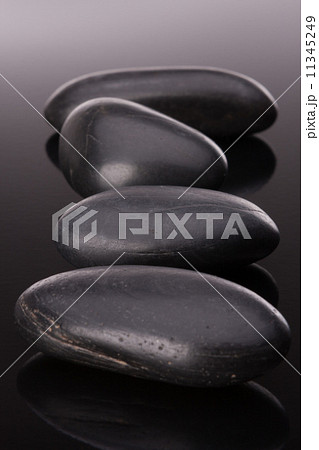 Spa stone arrangement on black surface 11345249