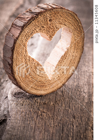 Light  heart on rustic wooden background 11345608