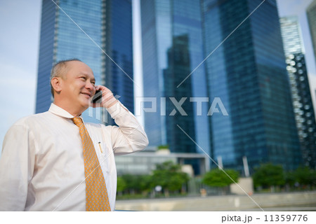 Businessman using phone Businessman using phone 11359776