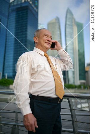 Businessman using phone 11359779