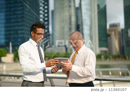 Businessman having discussion using tablet 11360107