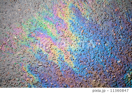 Background texture of an oil spill on asphalt road Background texture of an oil spill on asphalt road 11360847