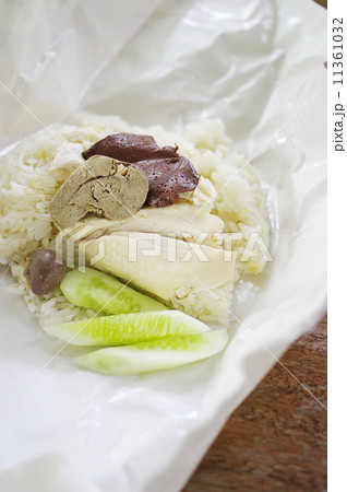 Steamed chicken with rice inside paper package Steamed chicken with rice inside paper package 11361032