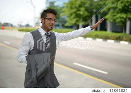 Businessman flagging for cab 11361822