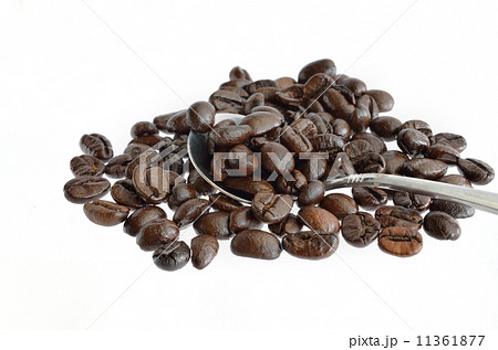 Coffee beans and silver spoon isolated on white 11361877