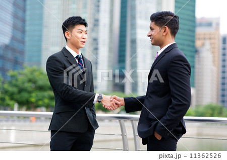 Partners sealing cooperation or agreement with a handshake Partners sealing cooperation or agreement with a handshake 11362526