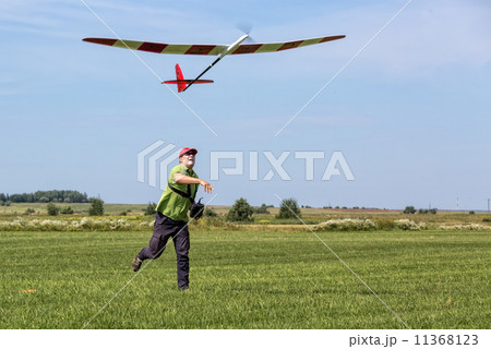 Man launches into the sky RC glider 11368123