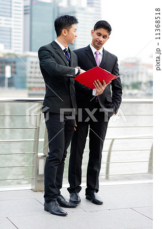 salesman is proposing his product to his client 11368518