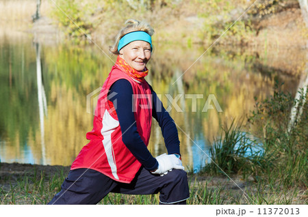 Woman making of the stretching in full nature Woman making of the stretching in full nature 11372013