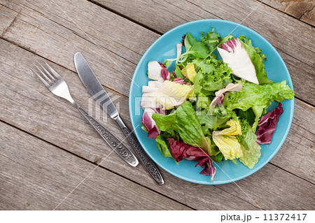 Fresh healthy salad and silverware Fresh healthy salad and silverware 11372417