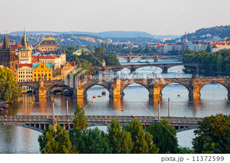 View of the Vltava River and the bridges shined with the sunset sun, Prague 11372599
