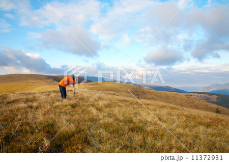 Photographer and autumn mountains 11372931