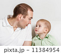 Dad and son look at one another 11384954