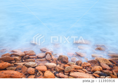 Shore of the sea, stones  and flowing water 11393916