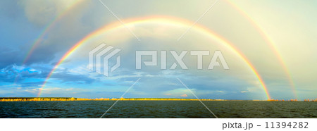 Rainbow above river Rainbow above river 11394282