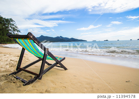 Wooden chairs rest at the beach 11394578