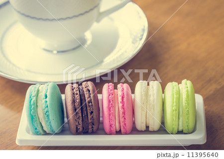 Colorful macaroons, delicious French pastries, on table 11395640