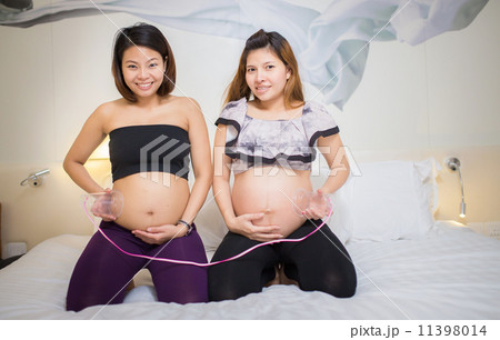 Two beautiful pregnant Asian women. Are happy 11398014