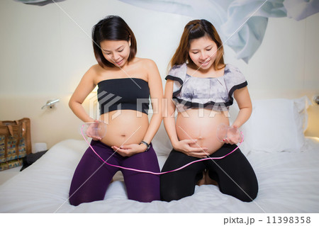 Two beautiful pregnant Asian women. Are happy 11398358