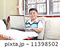Asian boy playing notebook for learning 11398502