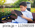 Asian boy playing Tablet fun 11398509