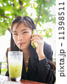 Asian young businesswomen Are using the phone to communicate 11398511
