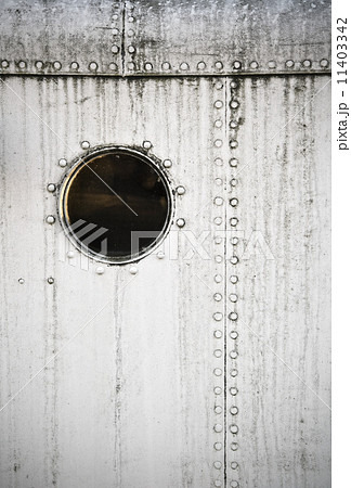 Porthole on the white metal naval wall Porthole on the white metal naval wall 11403342