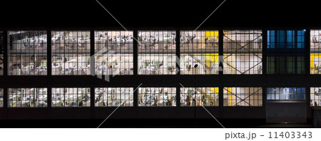 Wall with windows of an empty office building at night 11403343
