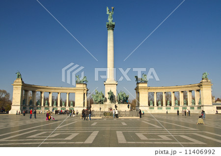 BUDAPEST - CIRCA MAR 2012: Tourists visit Millennium Monument in 11406992