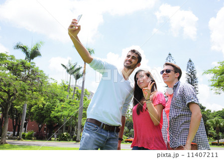 Group of happy friends taking selfie Group of happy friends taking selfie 11407211