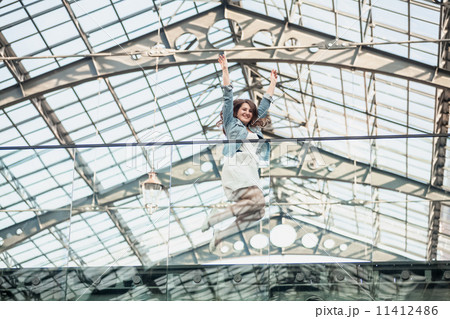 happy woman jumping up high at airport happy woman jumping up high at airport 11412486