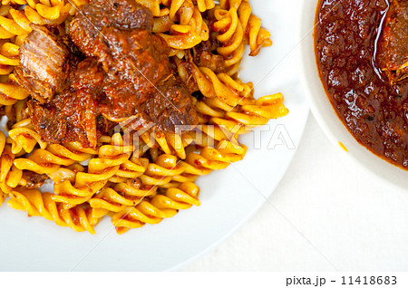 fusilli pasta with neapolitan style ragu meat sauce 11418683