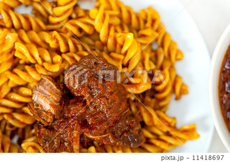 fusilli pasta with neapolitan style ragu meat sauce 11418697
