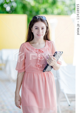 young attractive woman holding tablet 11418935