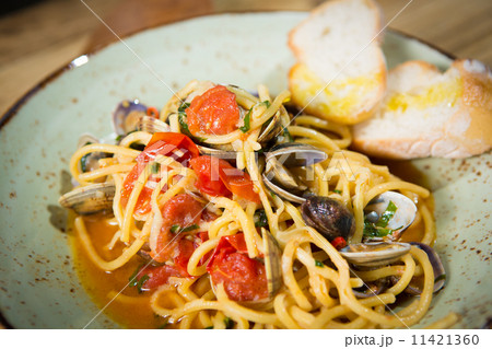 Homemade pasta with seafood and cherry tomatoes Homemade pasta with seafood and cherry tomatoes 11421360