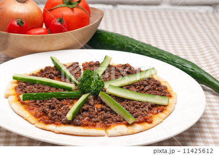 Turkish beef pizza with cucumber on top 11425612