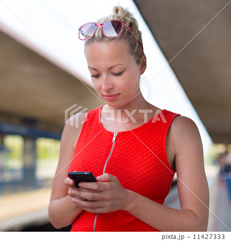 Young woman on platform of railway station. Young woman on platform of railway station. 11427333