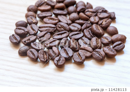 coffee beans on white wooden background coffee beans on white wooden background 11428113