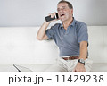 Adult Male Talking on a Mobile Phone. 11429238
