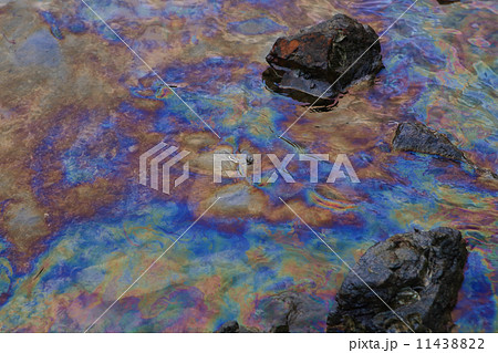 crude oil in sea water and rainbow reflection 11438822