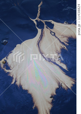 crude oil in sea water and rainbow reflection 11438824