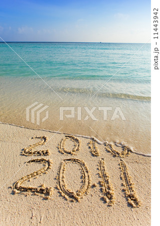 New 2011. The wave washes off an inscription 2010. New 2011. The wave washes off an inscription 2010. 11443942