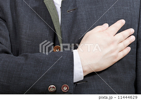 businessman holding his hand on his chest businessman holding his hand on his chest 11444629